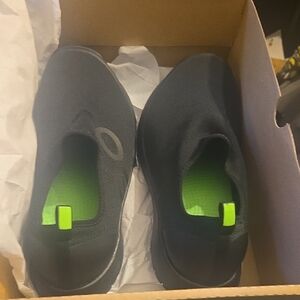 OOFOS Black Slip-On Sneakers with Neon Green Insole Accents